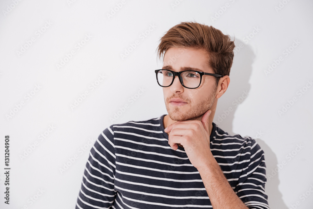 Pensive man in striped sweater Pensive man in striped sweater