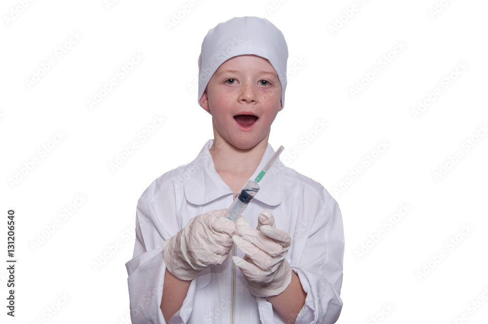 Boy was a doctor in a medical gown, cap, with syringe in hand on Boy was a doctor in a medical gown, cap, with syringe in hand on