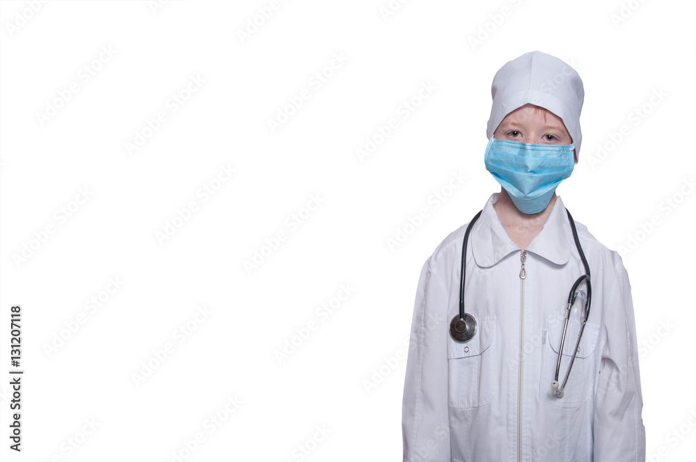 Child in a medical gown, cap, mask, stethoscope on a white backg Child in a medical gown, cap, mask, stethoscope on a white backg