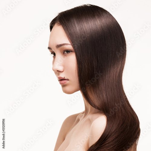 closeup portrait of asian girl with long straight hair isolated on white background