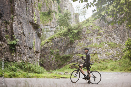 A young road cyclist taking a break from the climb in Cheddar Go