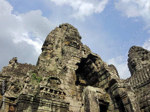Bayon temple with carved stone faces in Siem Reap Cambodia jungle