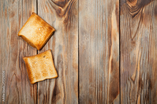 Toast on a rustic wooden background