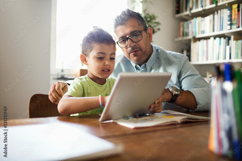 Father and son using tablet Father and son using tablet