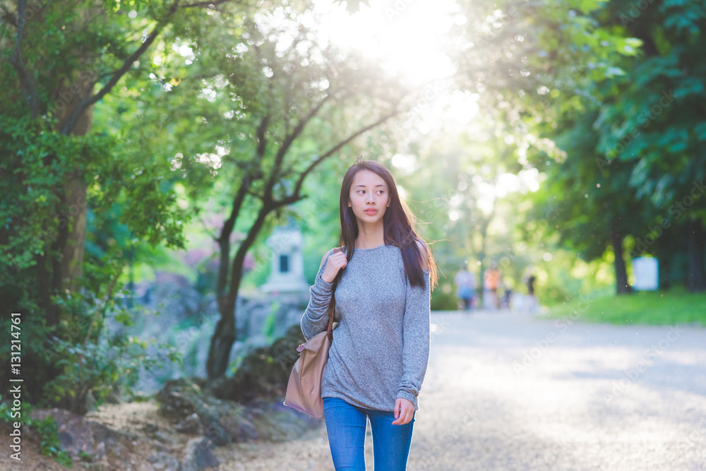 Young woman strolling in park Young woman strolling in park