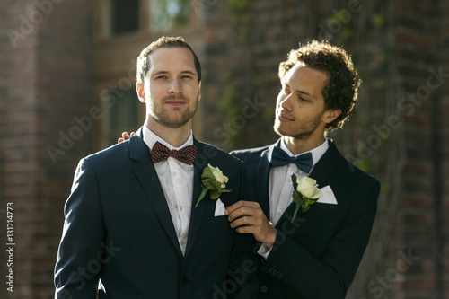 Portrait of confident gay man with newlywed partner