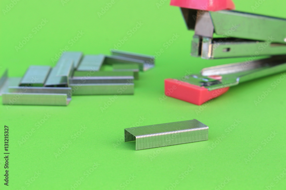 staples on isolated green