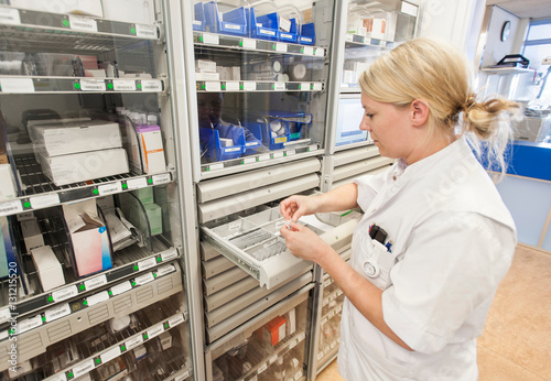 Nurse in hospital dispensary photo