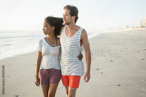 Romantic young couple strolling on beach, Cape Town, Western Cape, South Africa photo