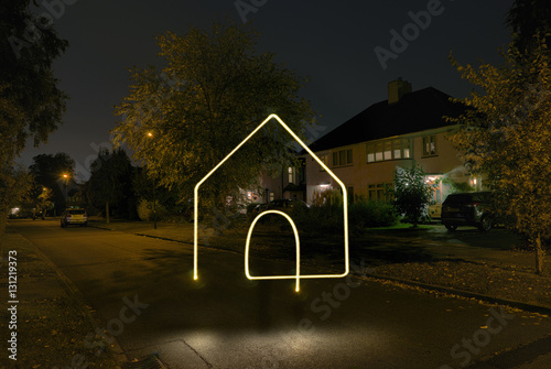 Illuminated house symbol photo