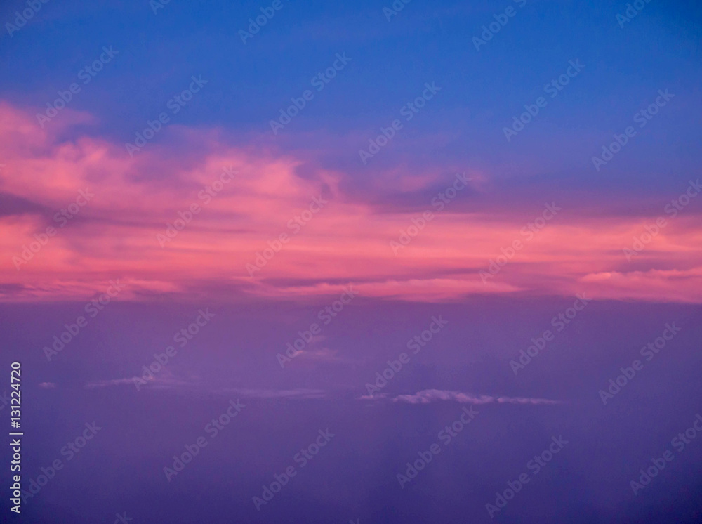 Fototapeta premium ariel view of clouds and sky in sunset above city