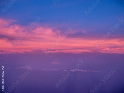 ariel view of clouds and sky in sunset above city