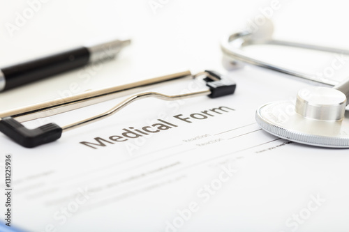 Wallpaper Mural Medical form and stethoscope on a desk Torontodigital.ca