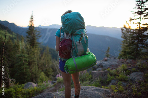 Hiker enjoying view on hilltop, Enchantments, Alpine Lakes Wilderness, Washington, USA