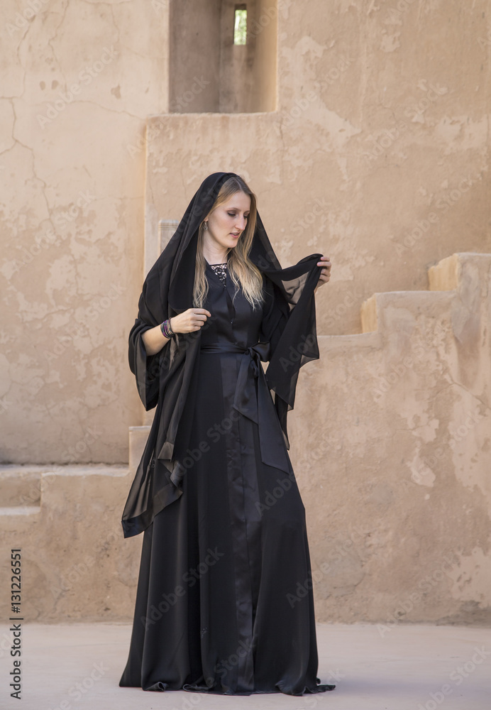 Woman in abaya in Jabreen castle