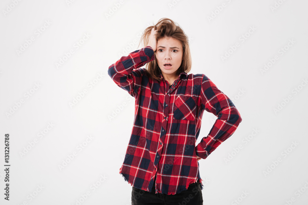 Girl in plaid shirt looking away Girl in plaid shirt looking away