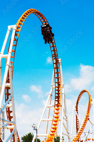 Low angle view of looped roller coaster at Coney Island amusement park, New York, USA