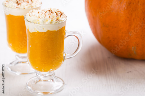 Pumpkin spiced latte or coffee. Autumn or winter hot drink. 