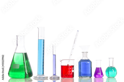 Various laboratory flasks with a colored reagents, pipette