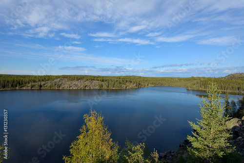 Blue Lake - Crystal blue lake surrounded by thick boreal forest. Yellowknife, NWT, Canada. © Sean Xu