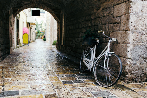 White vintage bicycle at old town in Budva, Montenegro