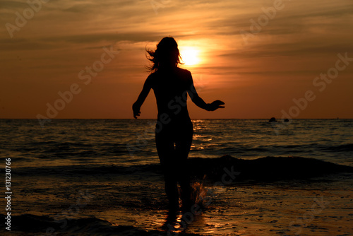 Girls sadow on the beach