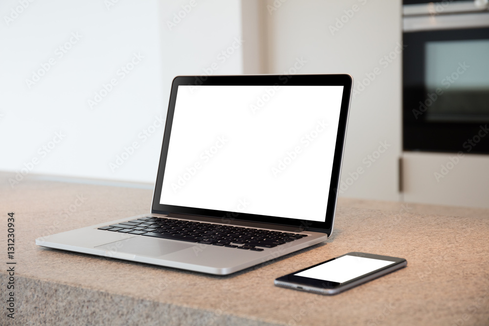 Fototapeta premium Laptop and phone on a table. Flat. Apartment. High definition photo.