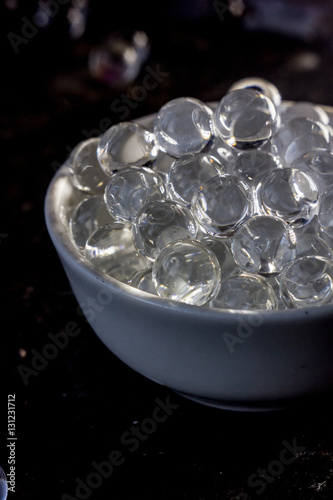 Hydrogel balls on white bowl.