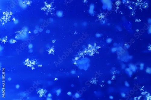 Snowflakes on blue background.