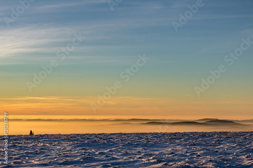 Minimalist winter mountain sunset landscape