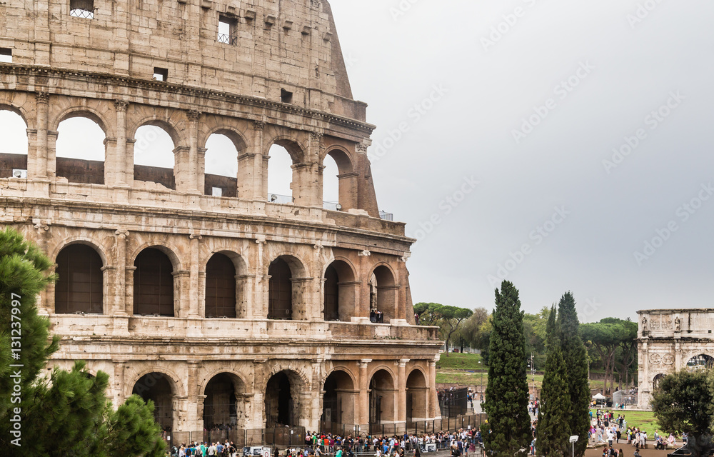 Obraz premium Tourists near Colosseum monument in Rome city. Italy