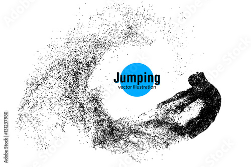Silhouette of a jumping man from particles.