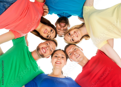 Students in colorful clothes holding together