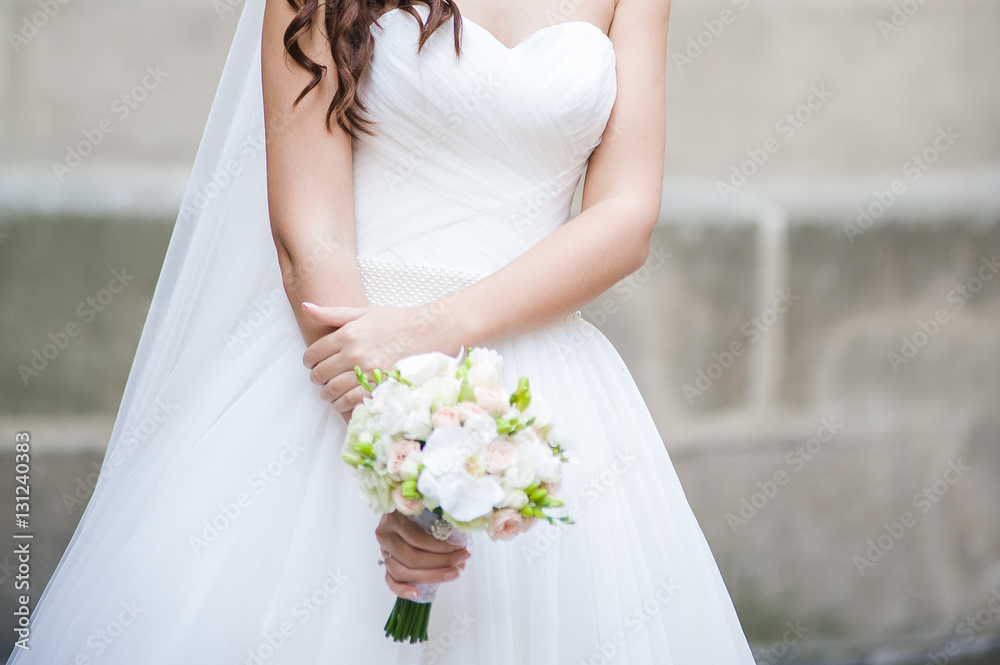 Beautiful bride with bouquet before wedding ceremony