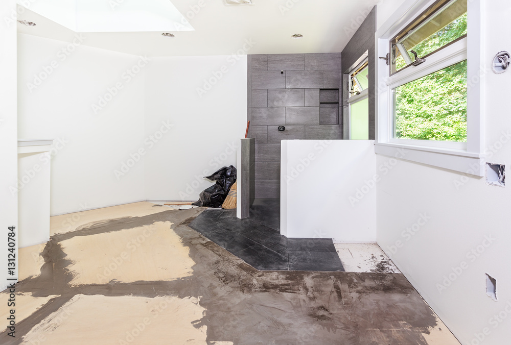 Plywood subfloor, seams covered with floor filler, in preparation for