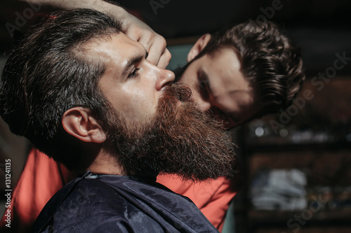 Handsome bearded man in barbershop