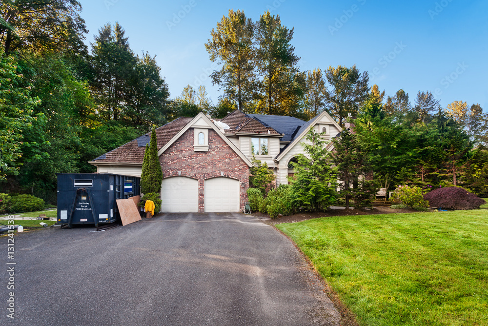 Fototapeta premium Re-roofing suburban house: old cedar shakes partially removed