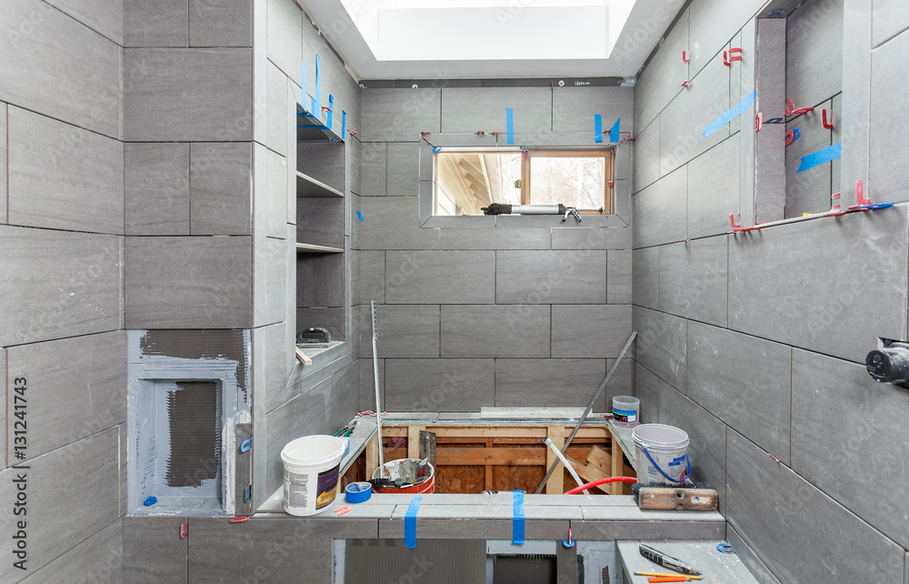 Wet room tiling in progress including shelves soap niche toilet paper niche and shower seat Stock Photo Adobe Stock