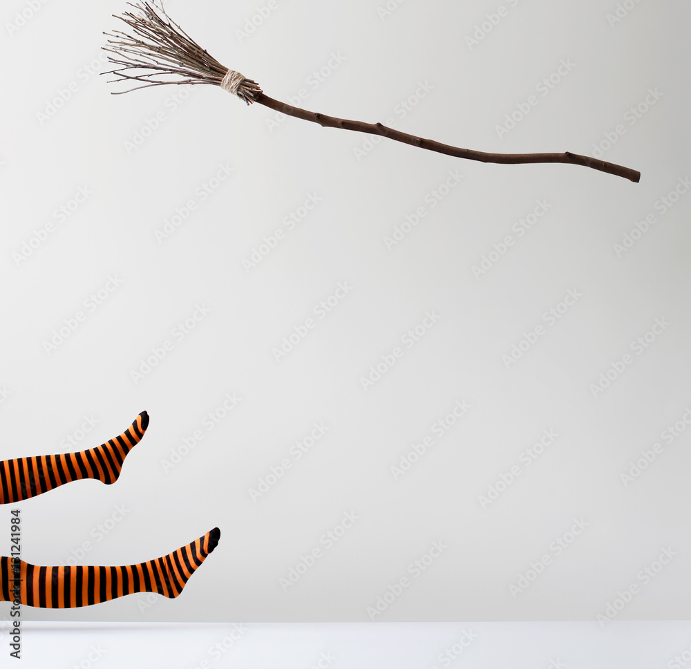 Witch falling off a broomstick StockFoto Adobe Stock