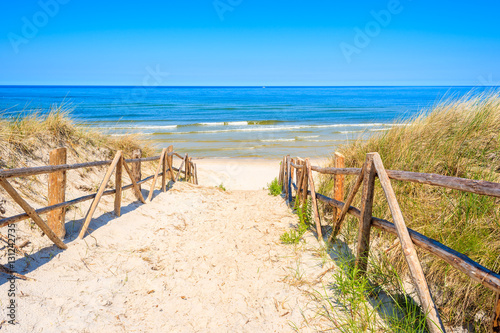 Entrance to sandy beach on coast of Baltic Sea near Lubiatowo village, Poland