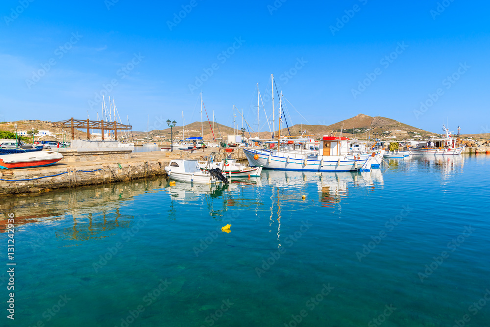 View of fishing boats anchoring in Naoussa port, Paros island, Greece