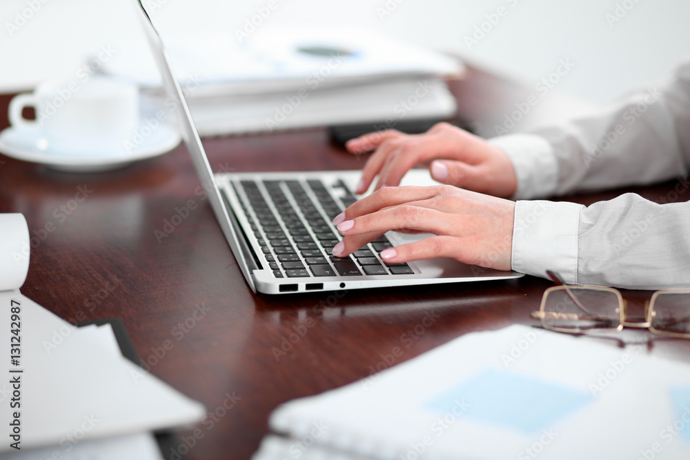 Close up of business woman hands typing on laptop computer Close up of business woman hands typing on laptop computer