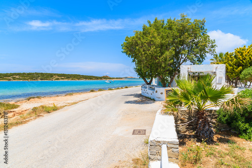 Coastal road along a beach near Naoussa village  Paros island  Greece