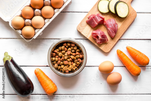 ingredients for pet food holistic top view on wooden background
