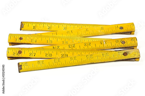 Fotografi vintage 1 meter yardstick (inch unit) isolated on white background