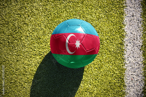football ball with the national flag of azerbaijan lies on the field