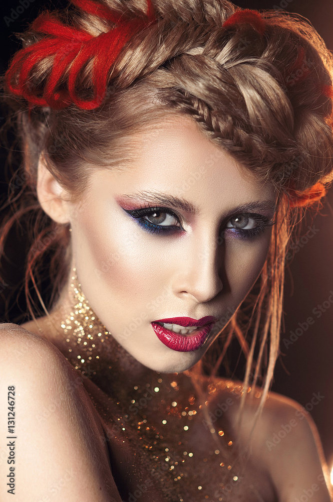 portrait of a beautiful girl with bright make-up with gold glitter portrait of a beautiful girl with bright make-up with gold glitter