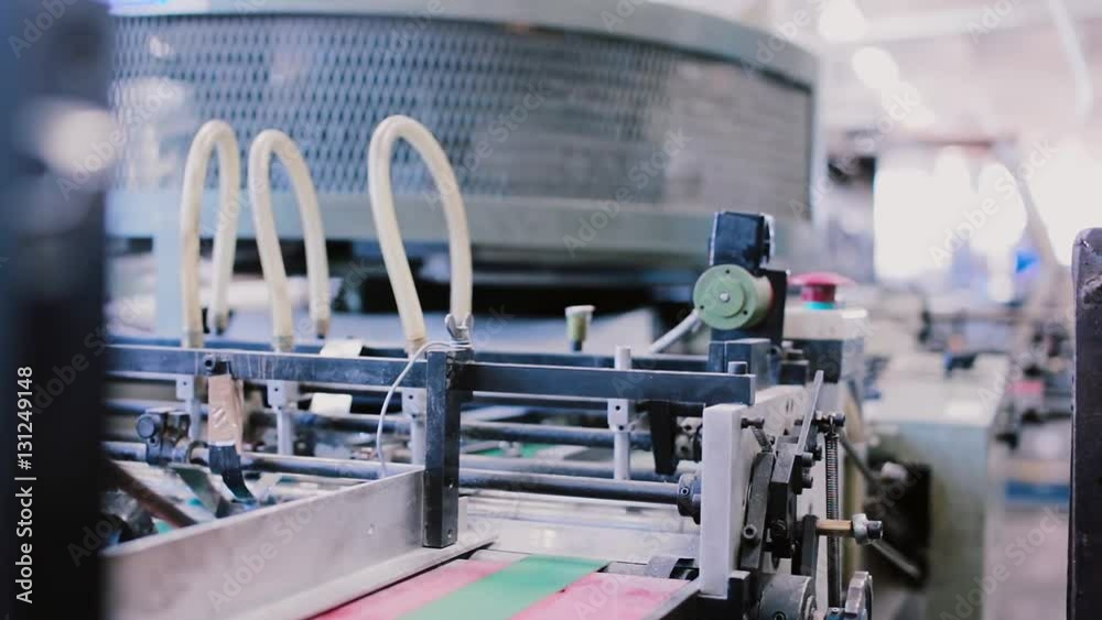 Newspapers in the process of publishing with sound. Printing establishment detail on production line with sound. Newspapers in the process of publishing with sound. Printing establishment detail on production line with sound.