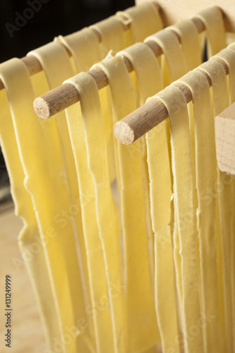 Quadro em tela Home made semolina noodles on an Italian pasta drying rack