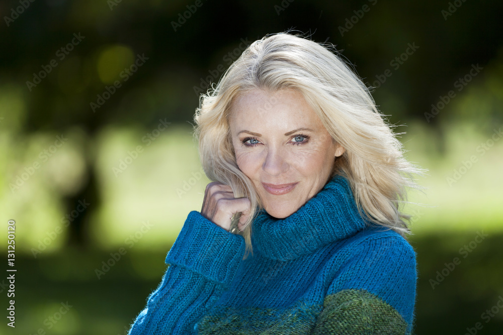 Portrait Of A Mature Woman Smiling At the Camera At The Park Portrait Of A Mature Woman Smiling At the Camera At The Park